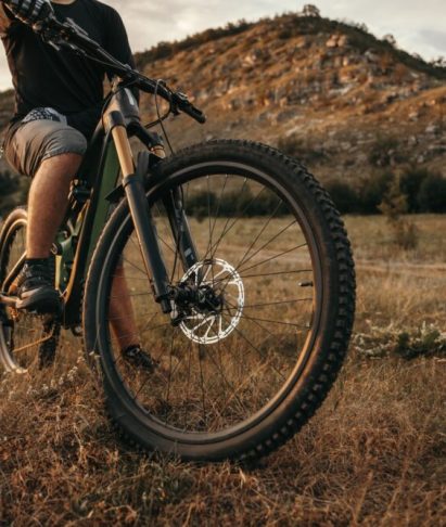 Cyclist on electric bike in mountains